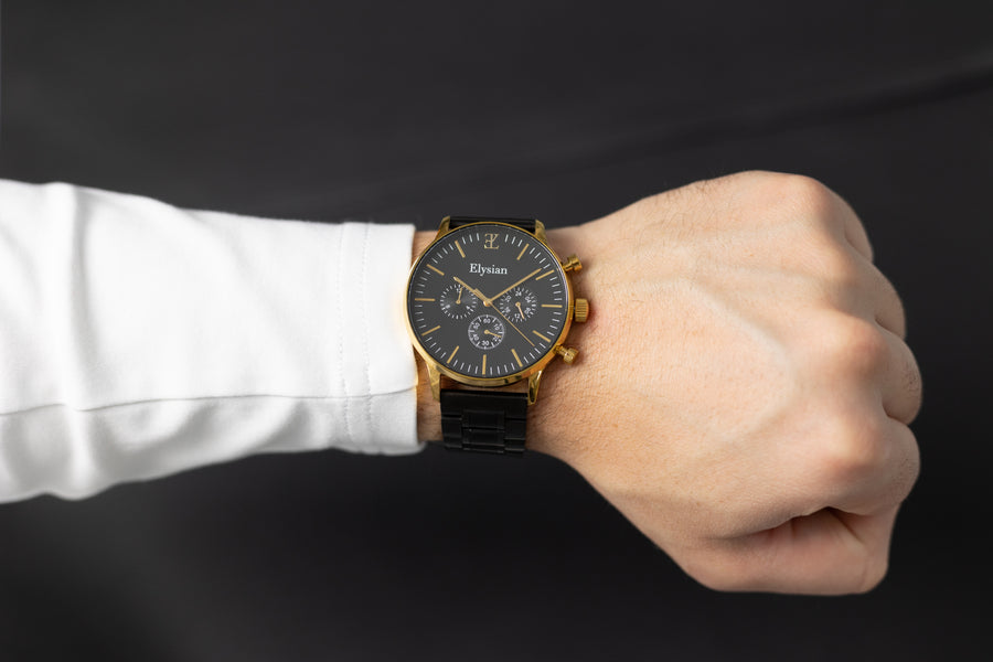 elysian-gouden-heren-horloge-zwart-plaat-zwart-schakelband-horlogeband-ELYWM00140-model